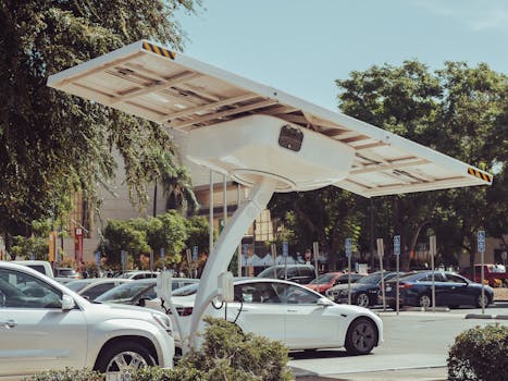 Modern solar-powered charging station for electric vehicles on a sunny day.